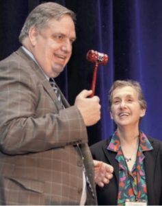 Ken Mack receives traditional CNS President’s gavel in 2015 from his predecessor, Nina Schor