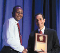 Dr. Edward Kija received a plaque and congratulations as the 2015 Bernard D’Souza Fellowship Awardee from CNS International Affairs Chair, Dr. Jorge Vidaurre.